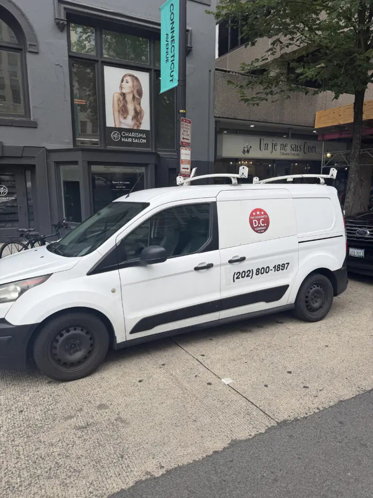 Mobile locksmith van for The Locksmith DC Company on a Washington DC street.